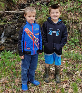 Two Students Hiking in the Woods