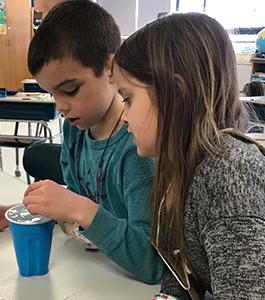 Students experimenting with water and ice